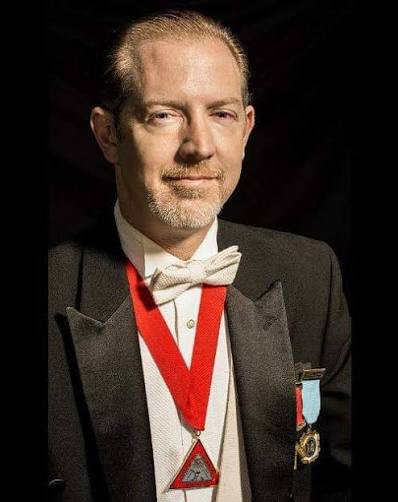 Formal portrait of Grandmaster Timothy W. Hogan in regalia