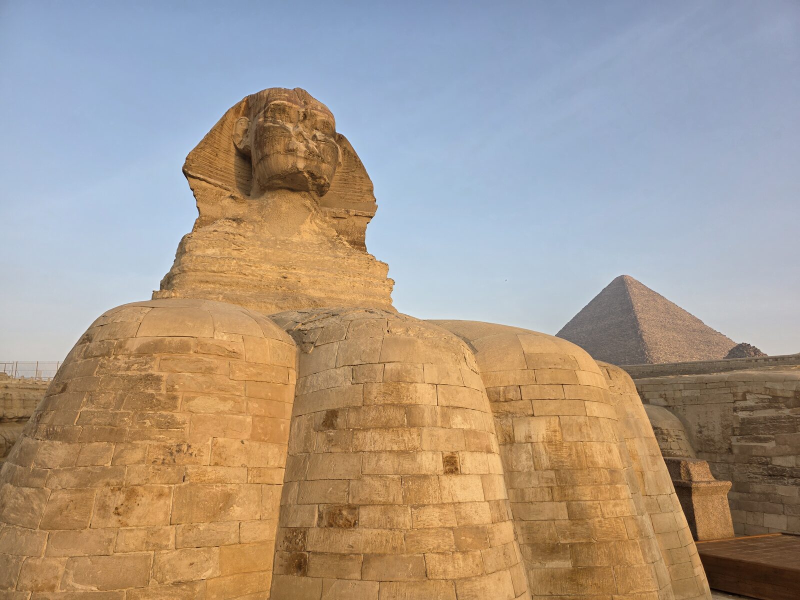 Traveler standing beside the right paw of the Great Sphinx