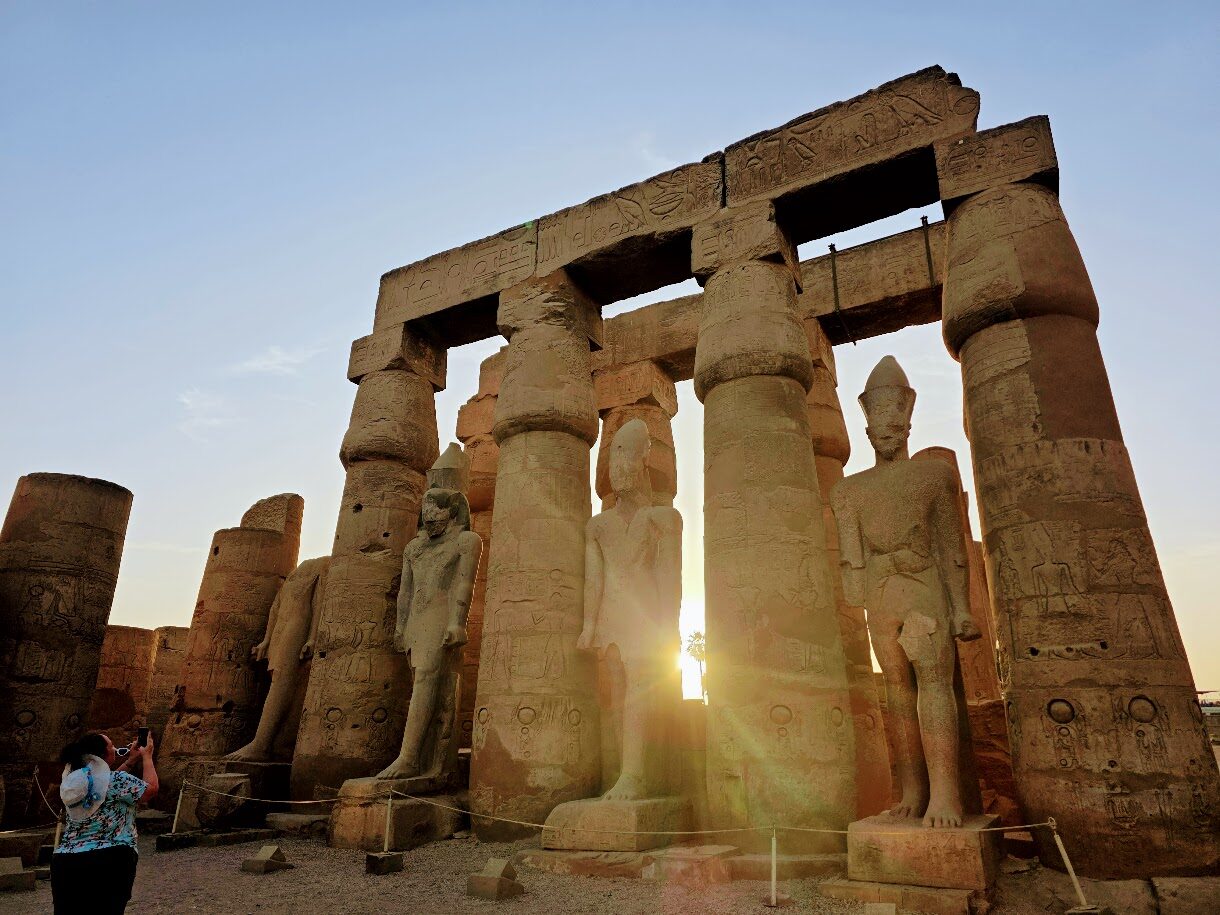 Sunlight streaming through the columns of Luxor Temple