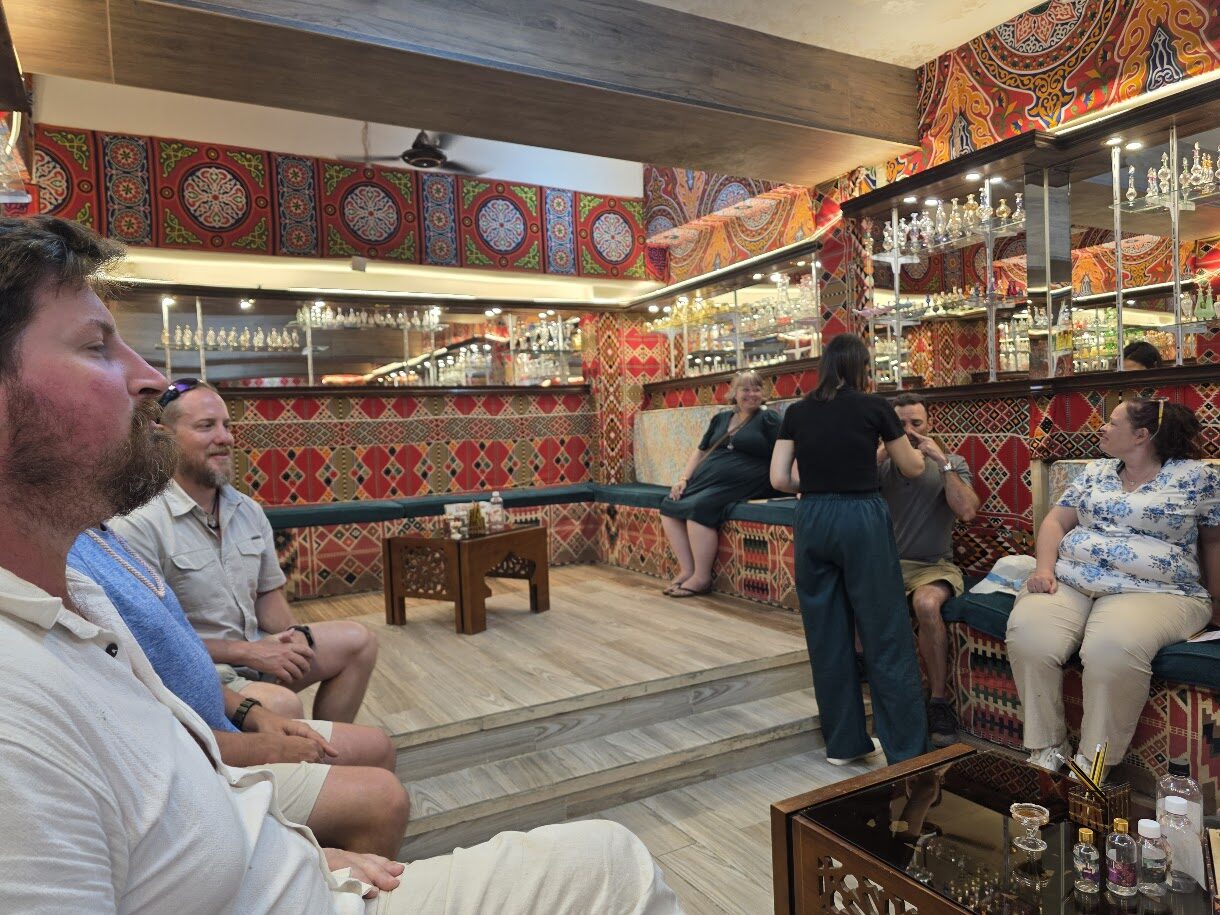 Traveler visiting a traditional oil shop near Philae